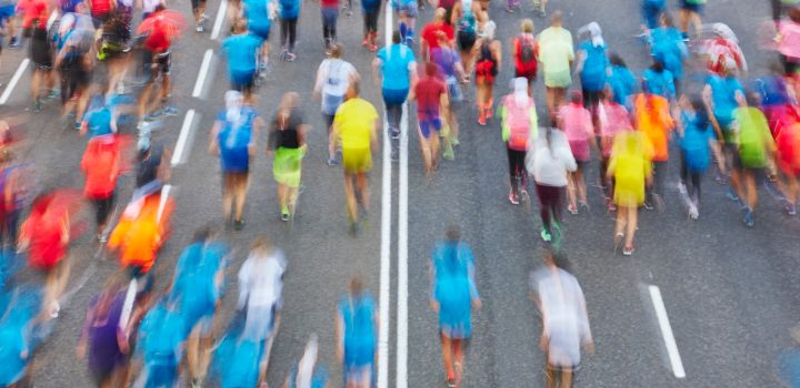 Runners on the street. Athletes in motion. Urban competition.