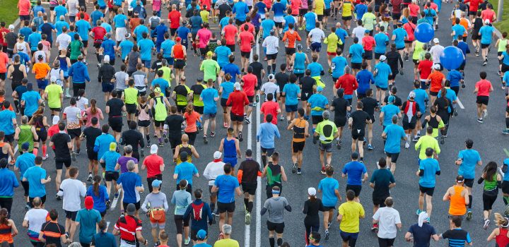 Runners on the street. Athletes in motion. Urban competition
