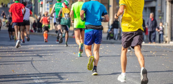 Marathon running race, runners running on city roads
