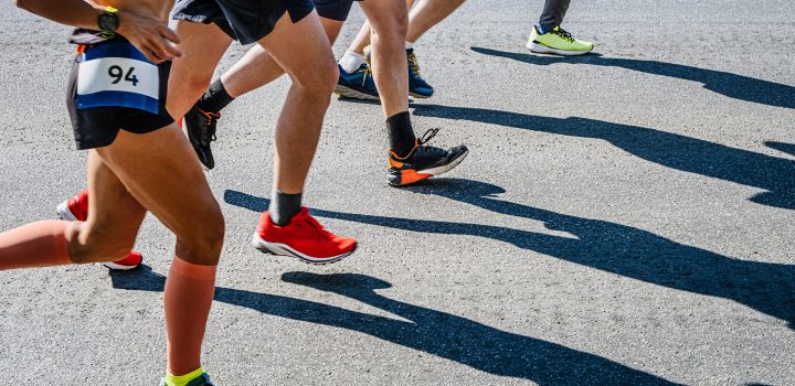 legs group runners run marathon race on road
