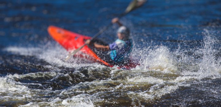 Kayak slalom canoe race in white water rapid river, process of kayaking competition with colorful canoe kayak boat paddling, process of canoeing with big water splash